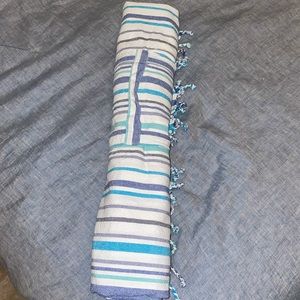 Blue roll up linen beach towel